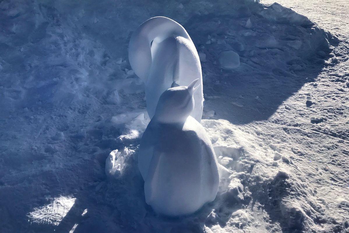 04C Emperor Penguin Ice Sculpture At Union Glacier Antarctica With Mount Rossmann Beyond